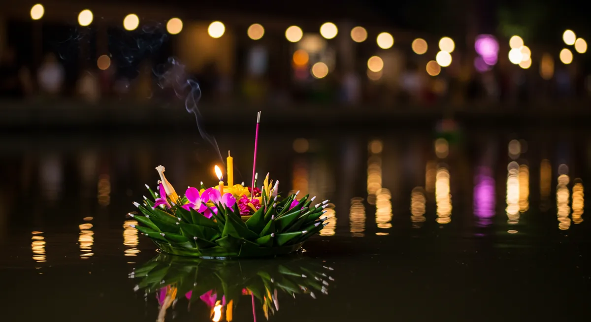 Handcrafted traditional krathong made with banana leaves, flowers, candles and incense